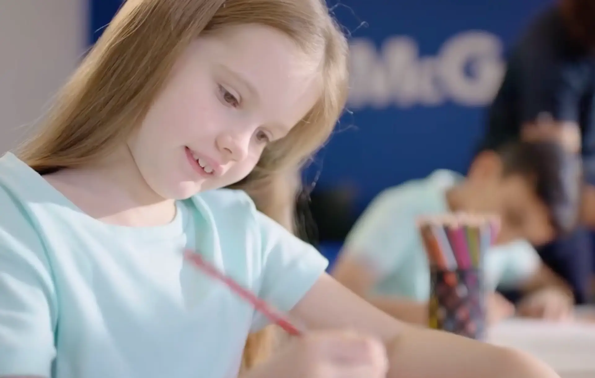Student smiling and learning during a session